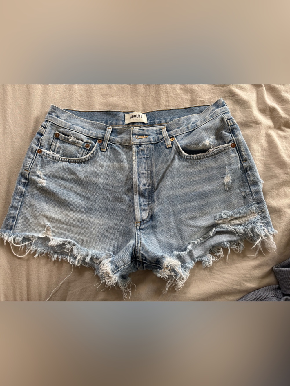 Agolde Faded Light Blue Distressed Cutoff Shorts